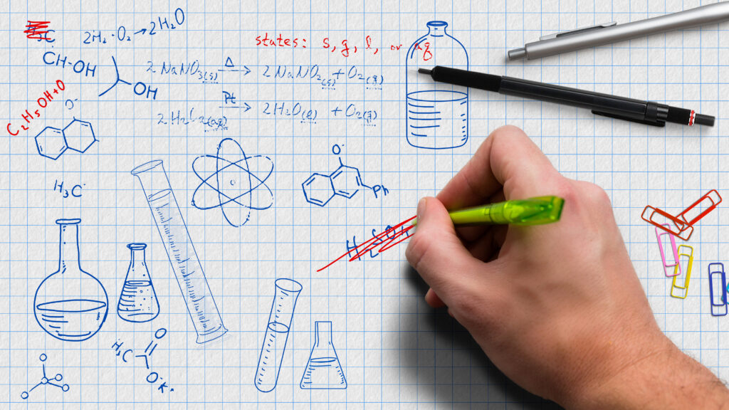 graph paper with chemistry notes and doodles as drawings to illustrate notes