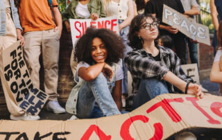 photo of diverse gen z teens and young adults taking a stand for social justice. Gen Z activists